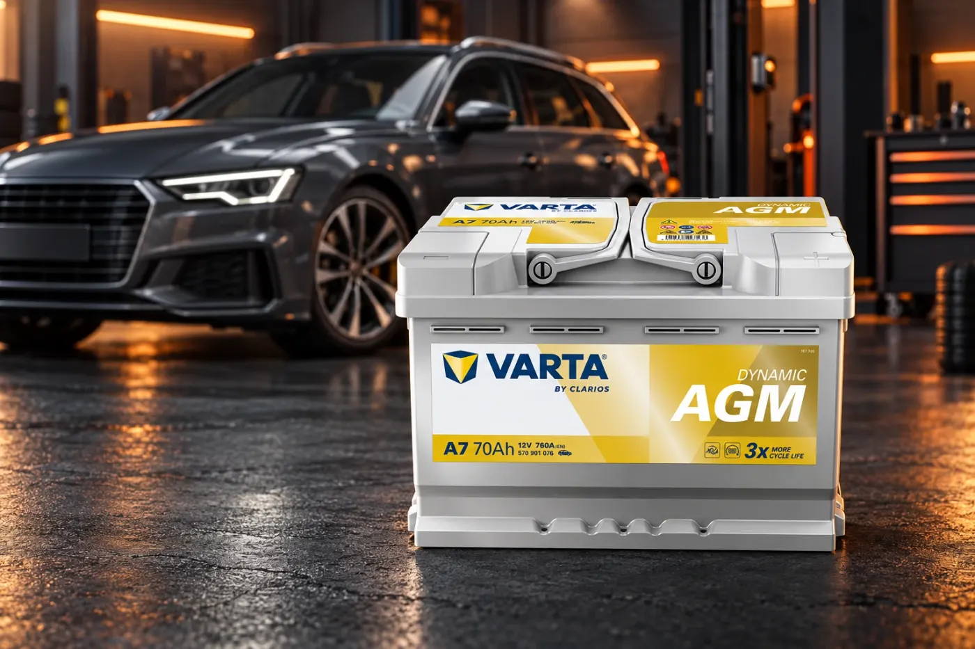 Varta AGM car battery in front of a car in a workshop